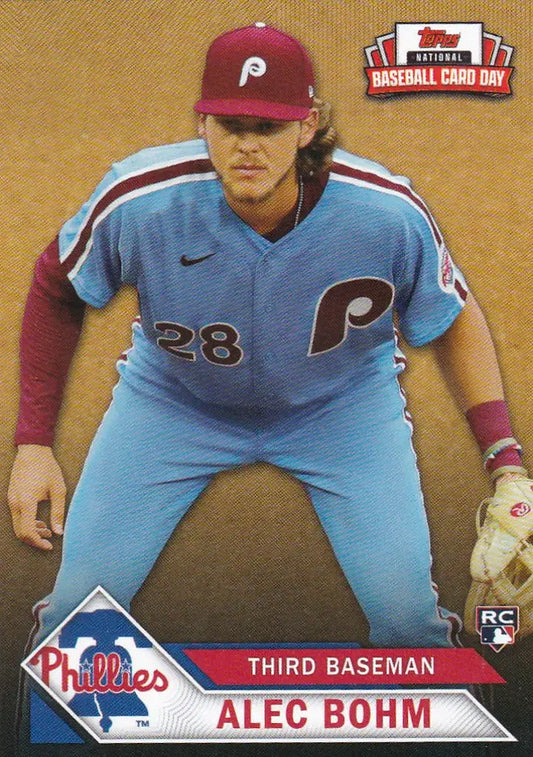 Baseball card of Alec Bohm Philadelphia Phillies in light blue uniform and red cap