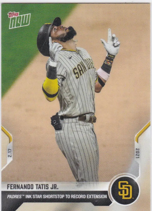 Baseball trading card of Fernando Tatis San Diego in pinstripes pointing skyward