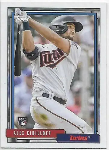 Baseball card of Alex Kirilloff swinging bat in Twins uniform, with original gloss finish