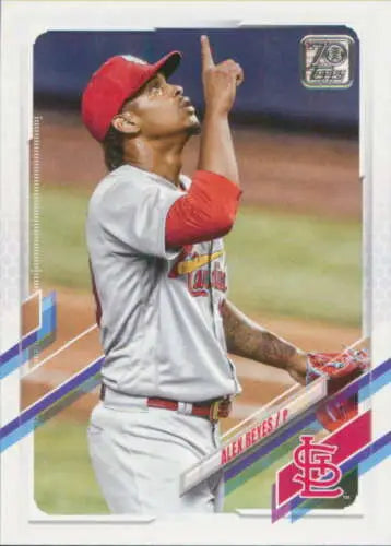 Baseball player in St. Louis Cardinals uniform pointing upward on 2021 Topps Update card