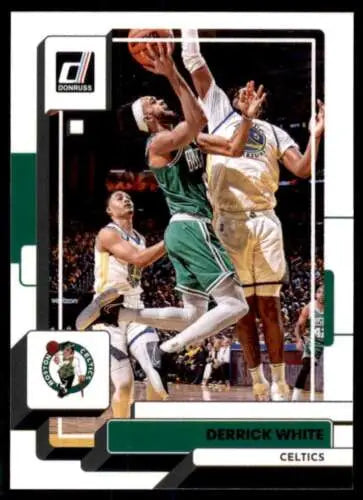 Derrick White shooting against defenders on 2022-23 Donruss basketball trading card