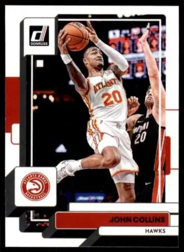 Basketball trading card of John Collins in mid-jump for the Atlanta Hawks, original gloss