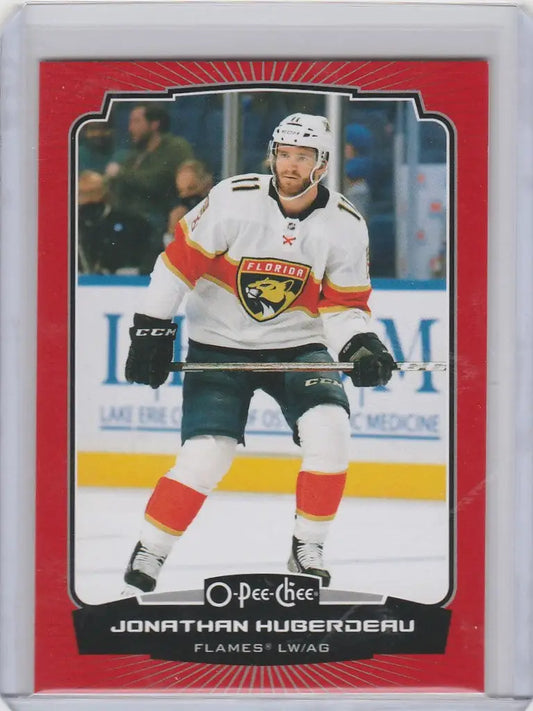 Hockey trading card of Jonathan Huberdeau Calgary Flames in white jersey on ice