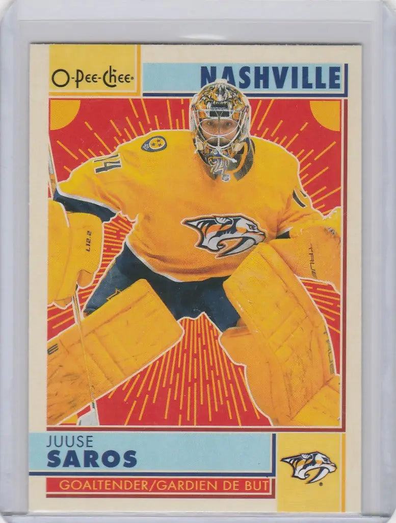 Hockey trading card of Juuse Saros in a bright yellow Nashville Predators jersey