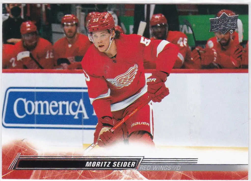 Ice hockey player in red Detroit Red Wings jersey, Moritz Seider skating on ice