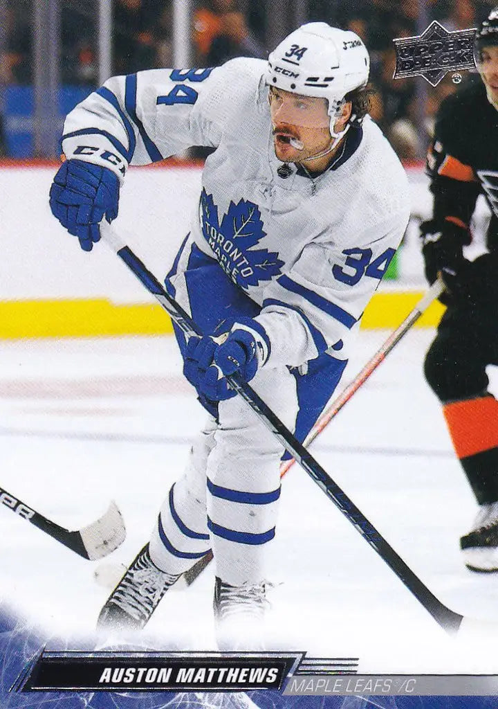 Auston Matthews in a Toronto Maple Leafs jersey skating with a hockey stick on ice