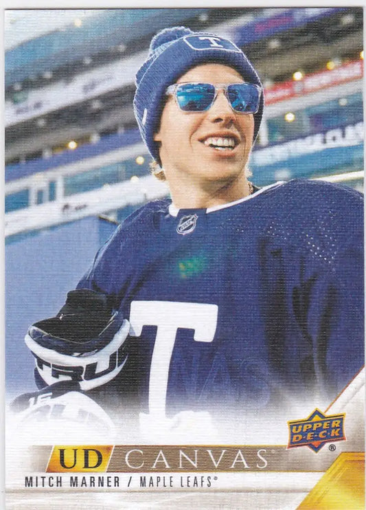 Hockey player in blue jersey and sunglasses smiling, featuring Mitch Marner Canvas design