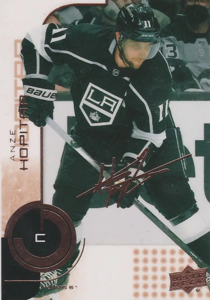 Ice hockey player in black Los Angeles Kings jersey for 2022-23 Upper Deck MVP 20th Anniversary