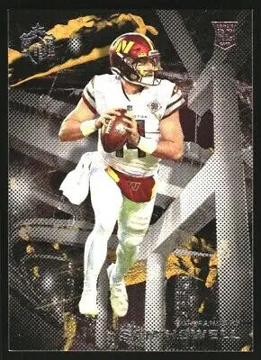 Football player in uniform holding football on 2022 Panini Chronicles Gridiron Kings card