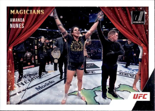 Victorious UFC fighter Amanda Nunes celebrates in the octagon on Panini Donruss UFC card