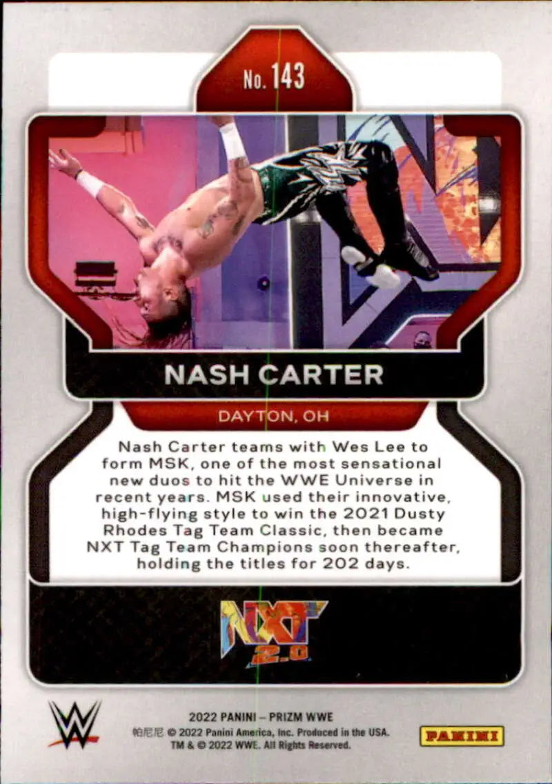 Nash Carter performing an aerial maneuver in a pink-lit ring on Panini Prizm WWE card