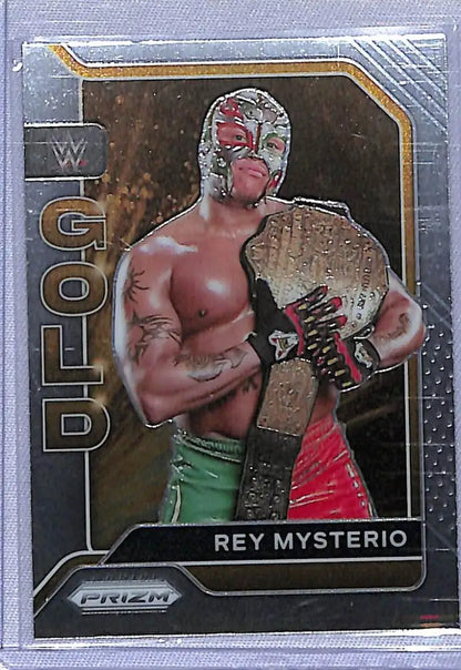 WWE trading card of Rey Mysterio holding a championship belt from Panini Prizm WWE