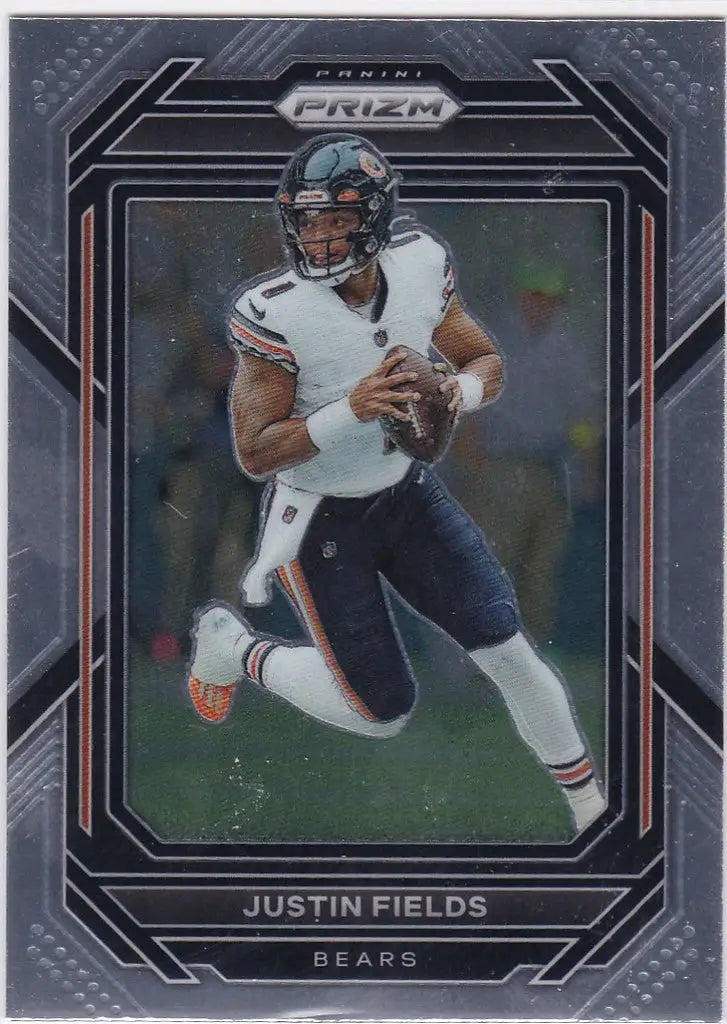 Football trading card of Justin Fields Chicago Bears running with the ball in a white jersey