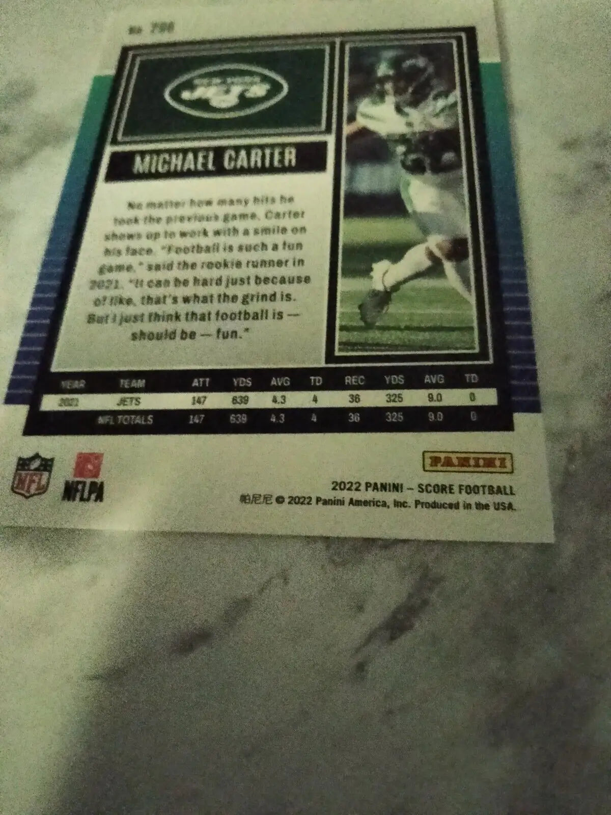 Michael Carter 2022 Score Football Card 296 featuring New York Jets rookie player