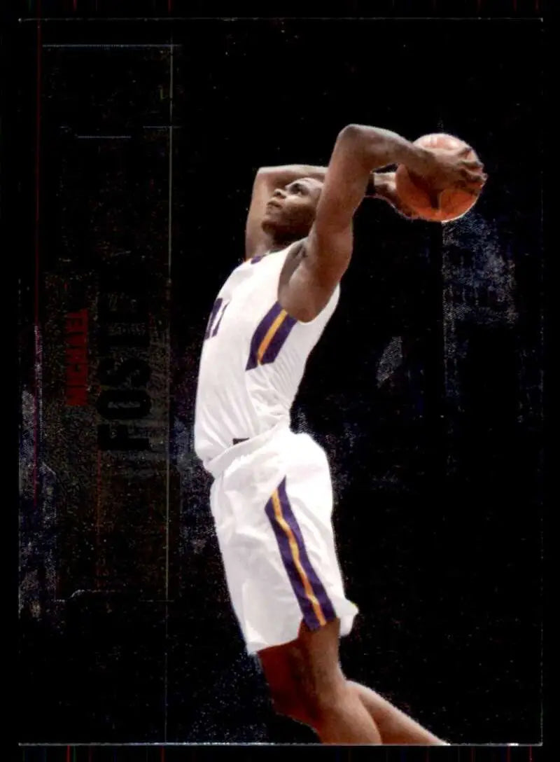 Basketball player in white uniform jumping for a dunk on Skybox Metal Universe card