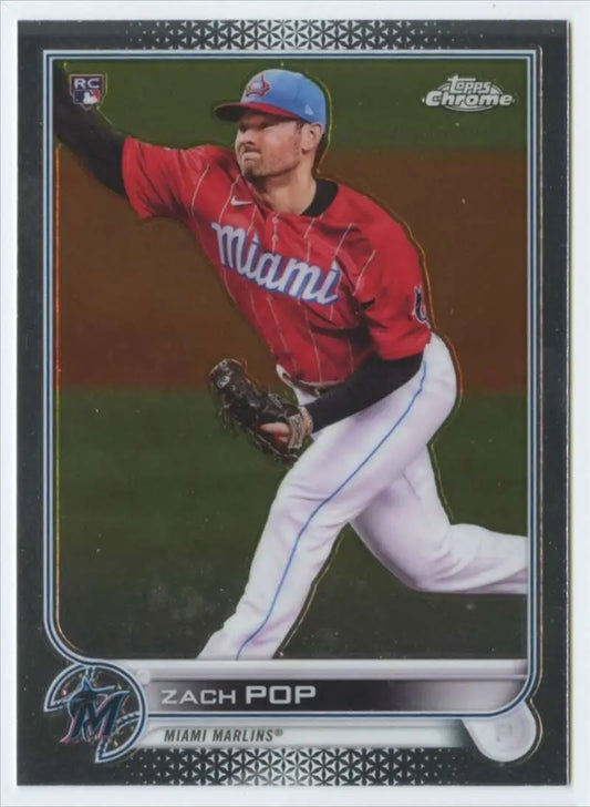 Baseball card of Zach Pop in a red uniform mid-delivery from Topps Chrome rookie card