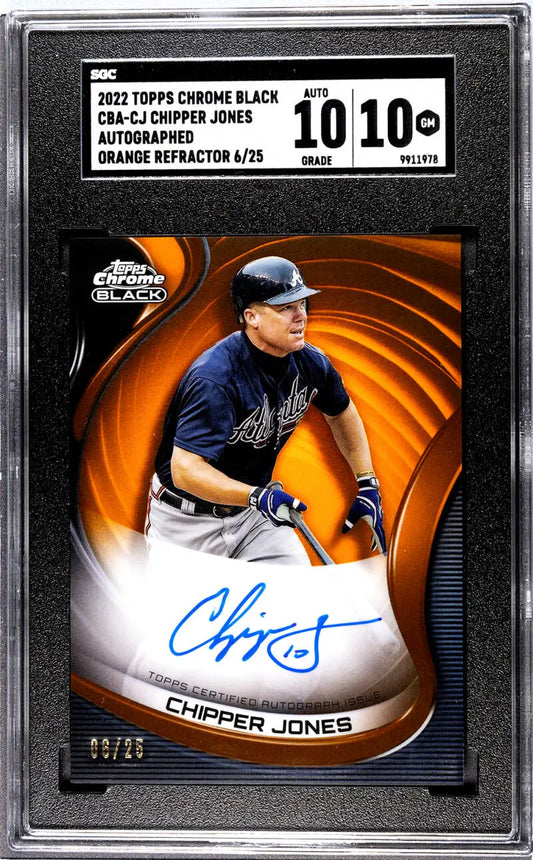 Graded 2022 Topps Chrome Black Orange Chipper Jones auto baseball card on orange swirl