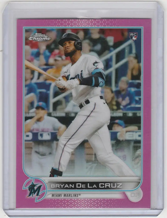 Baseball card of Bryan De La Cruz swinging for the Miami Marlins in Topps Chrome Pink