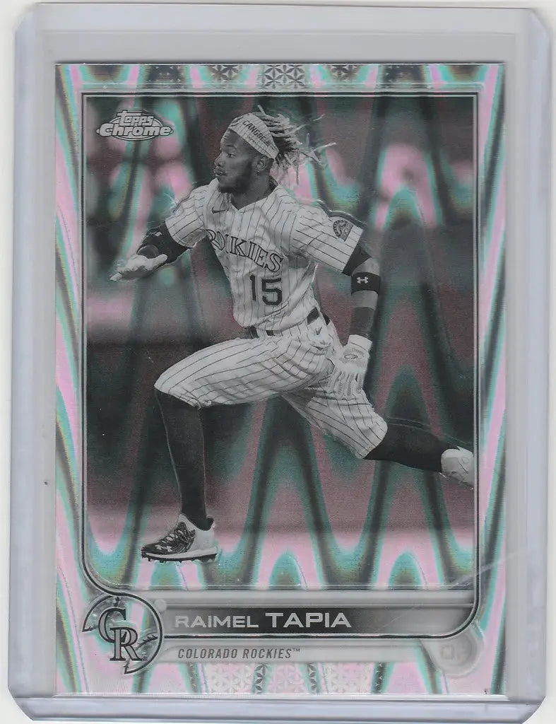 Baseball trading card of Raimel Tapia in mid-stride for Topps Chrome Raywave, Colorado Rockies