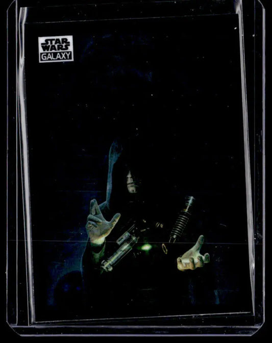 Dark-robed figure wielding glowing green lightsabers on Star Wars trading card