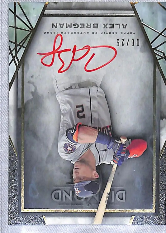 Baseball card of Alex Bregman sliding with red ink autograph for Houston Astros