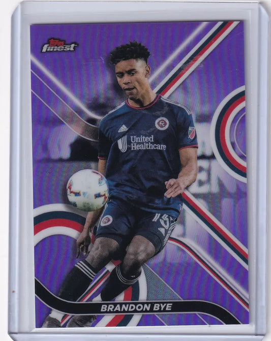 Soccer trading card of Brandon Bye in Topps Finest Purple uniform with a vibrant background