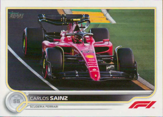 Red Ferrari Formula 1 racing car featuring Carlos Sainz on a race track for Topps Formula 1