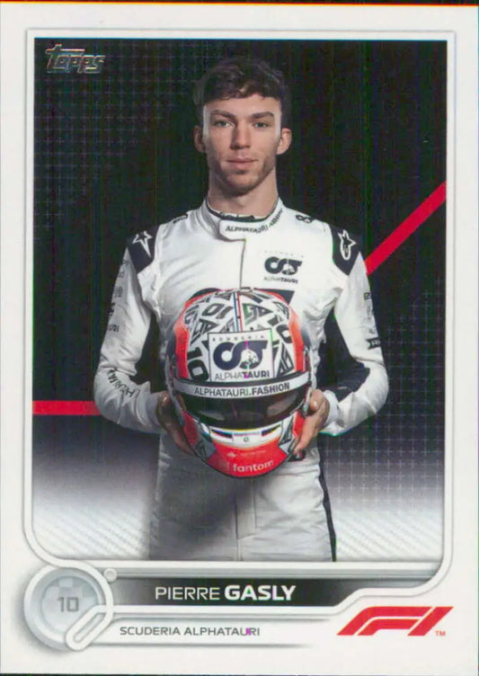 Pierre Gasly in AlphaTauri gear holding helmet for Topps Formula 1 racing card