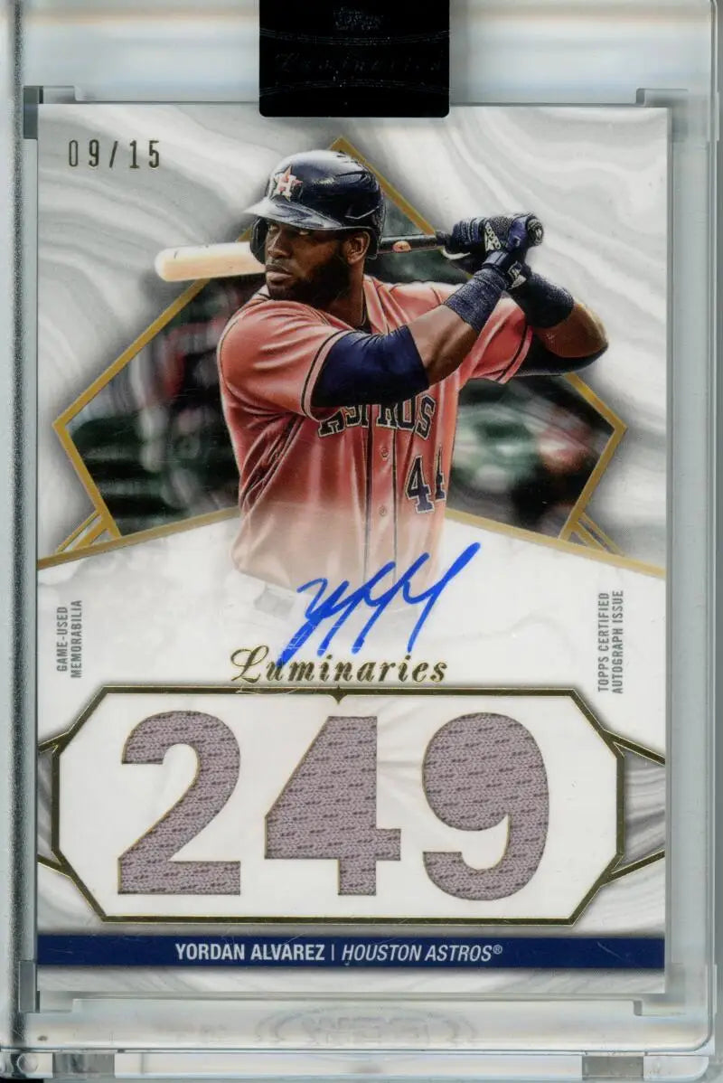 Baseball card of Yordan Alvarez in red jersey, autographed, from Topps Luminaries