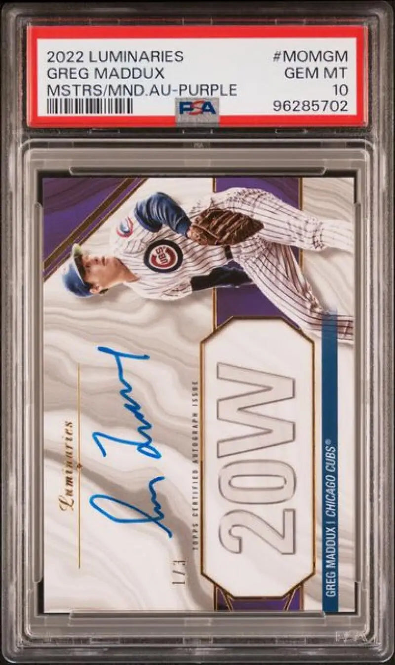 PSA-graded baseball card of Greg Maddux in Cubs pinstripes with autograph and design