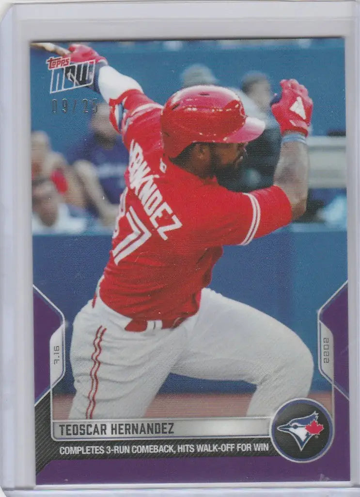 Baseball card of Teoscar Hernandez Toronto Blue Jays mid-swing in red uniform