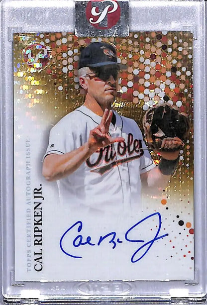 Signed Cal Ripken Jr. 2022 Topps Pristine Refractor Gold baseball card with prismatic pattern