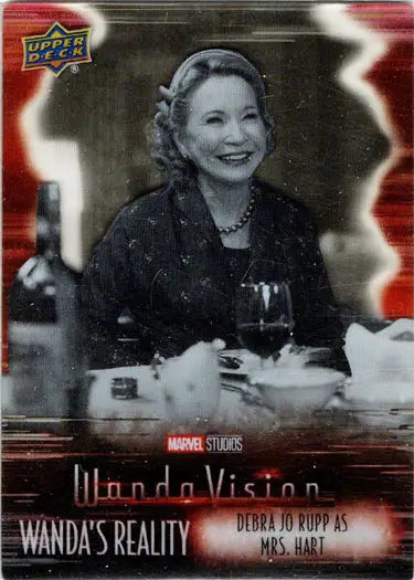 Black and white trading card from Marvel’s WandaVision featuring a smiling woman at dinner