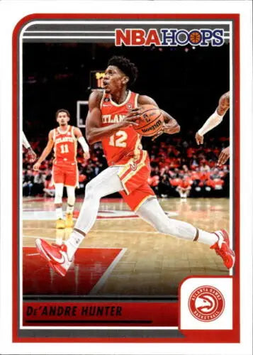 NBA Hoops trading card featuring De’Andre Hunter dribbling in red for the Hawks