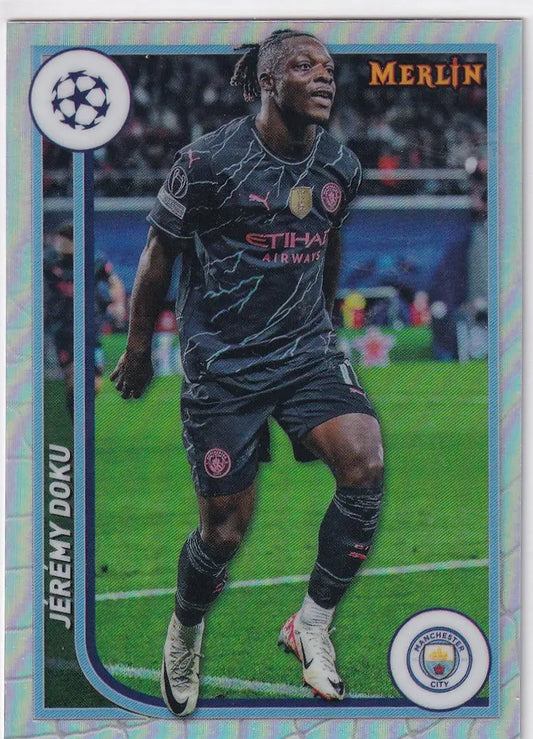 Soccer trading card of Jérémy Doku in dark away kit from Topps UCC Merlin Chrome Refractor