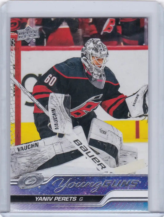 Hockey trading card of Yaniv Perets Young Guns RC making a save for Carolina Hurricanes