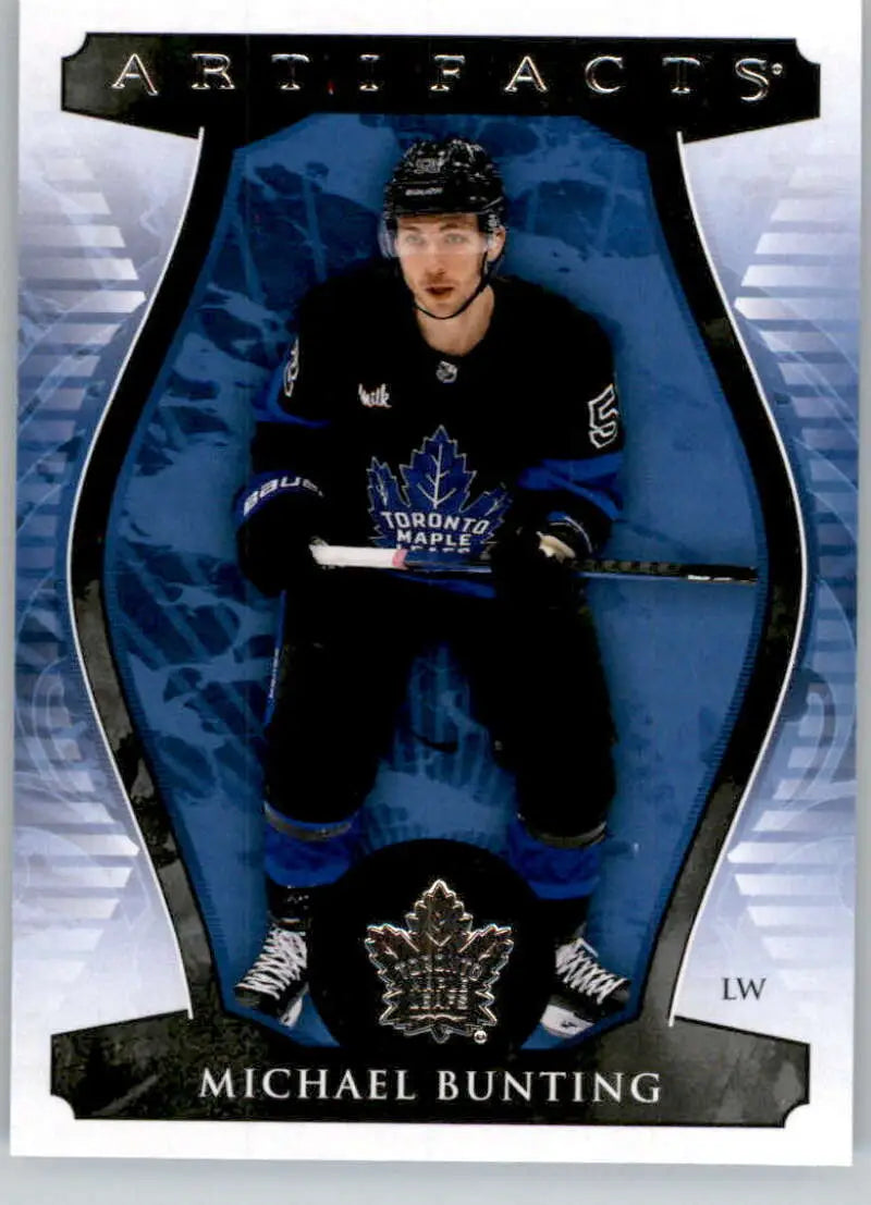 Hockey trading card of Michael Bunting in dark uniform for Toronto Maple Leafs