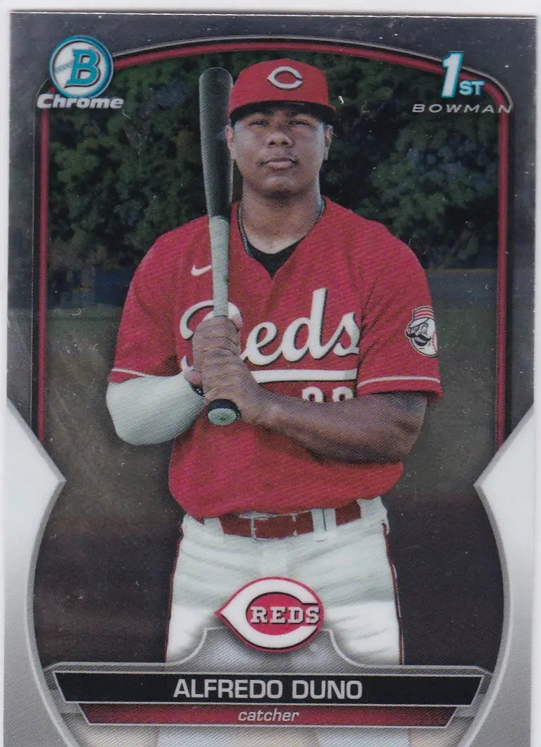 Baseball card of Alfredo Duno 1st Bowman Cincinnati Reds player in red uniform