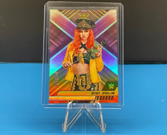 WWE trading card of Gigi Dolin in yellow attire from Panini Chronicles WWE limited edition