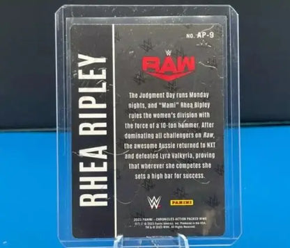 Trading card in a protective case featuring WWE RAW from Panini Chronicles WWE