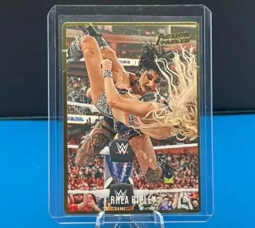 WWE trading card of Rhea Ripley performing an acrobatic move from Panini Chronicles WWE