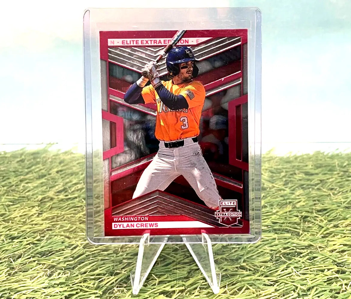 Baseball card of Astros player in orange jersey in clear holder for Panini Elite Extra Edition