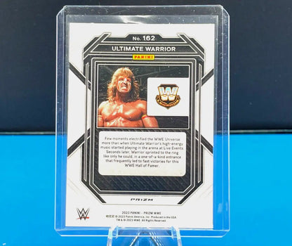 Ultimate Warrior wrestling card from 2023 Prizm WWE Silver Cracked Ice collection