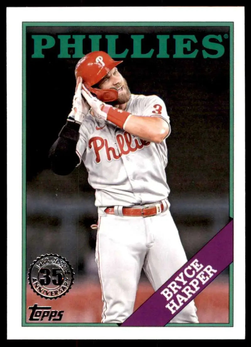 Bryce Harper swinging a bat in white Philadelphia Phillies uniform baseball card image