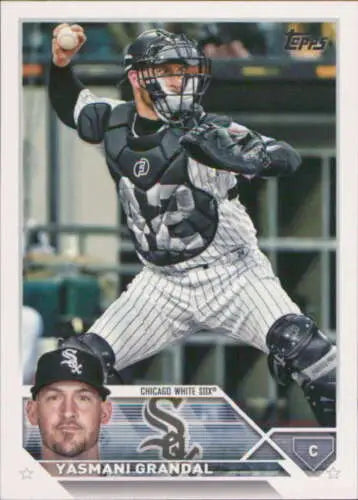 Baseball card featuring Yasmani Grandal in pinstripes making a throwing motion