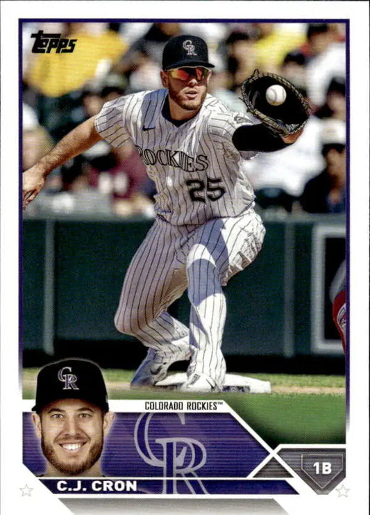 C.J. Cron fielding a ball on a Colorado Rockies baseball card 2023 Topps #63