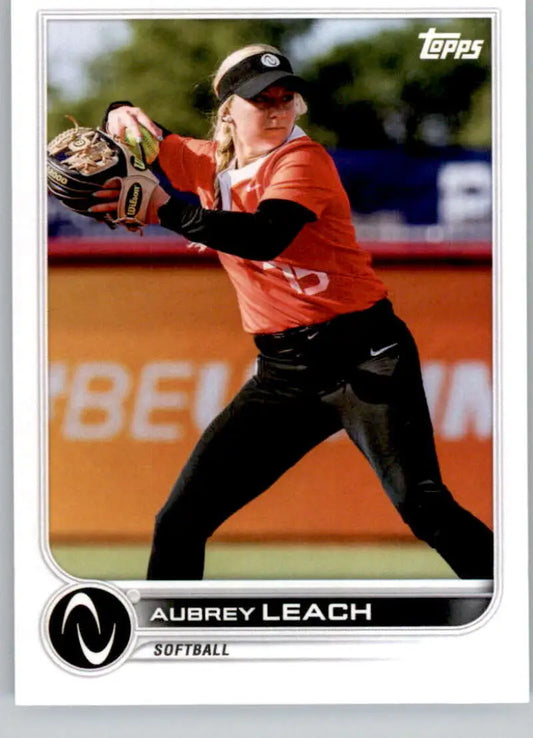 Softball player in orange jersey fielding for Topps Athletes Unlimited Aubrey Leach