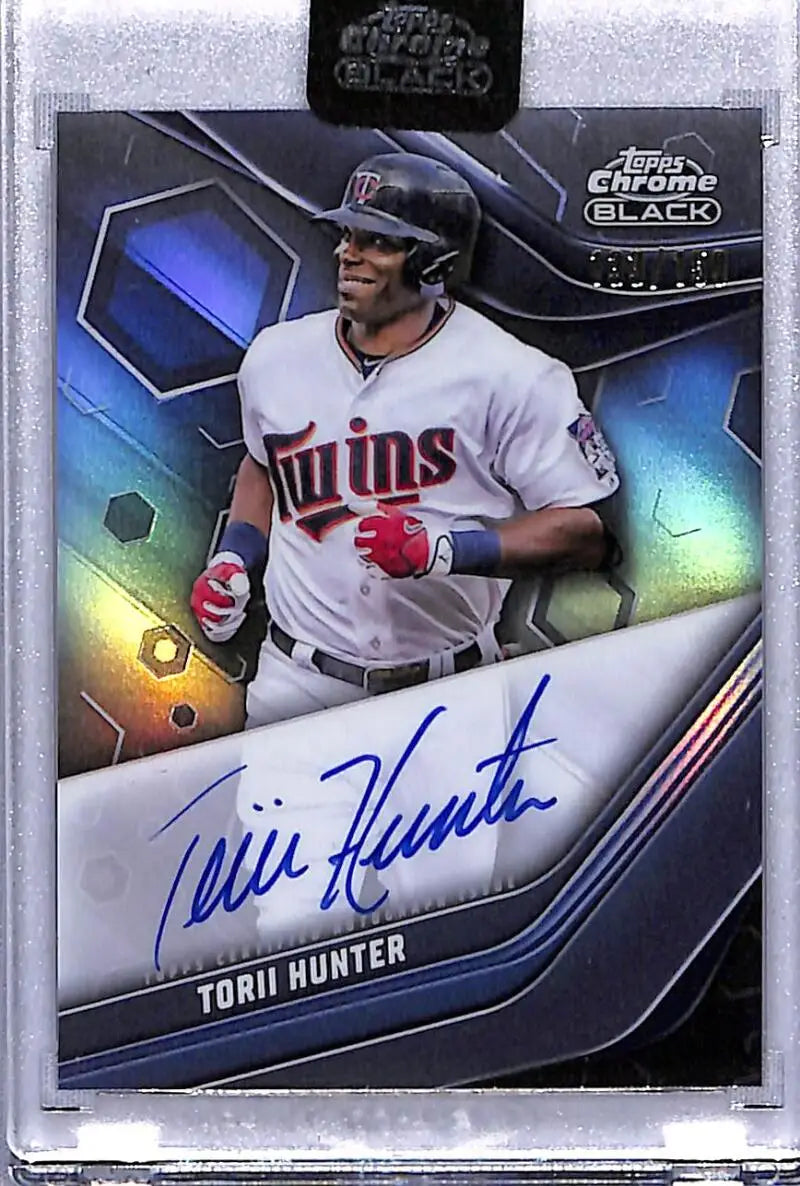 Signed Torii Hunter Minnesota Twins baseball card with chrome black finish and blue design