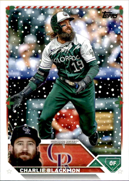 Tomps Holiday baseball card of Charlie Blackmon in a green uniform with snow effect