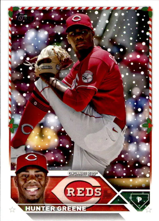 Baseball card of Hunter Greene, Cincinnati Reds pitcher in red uniform mid-throw